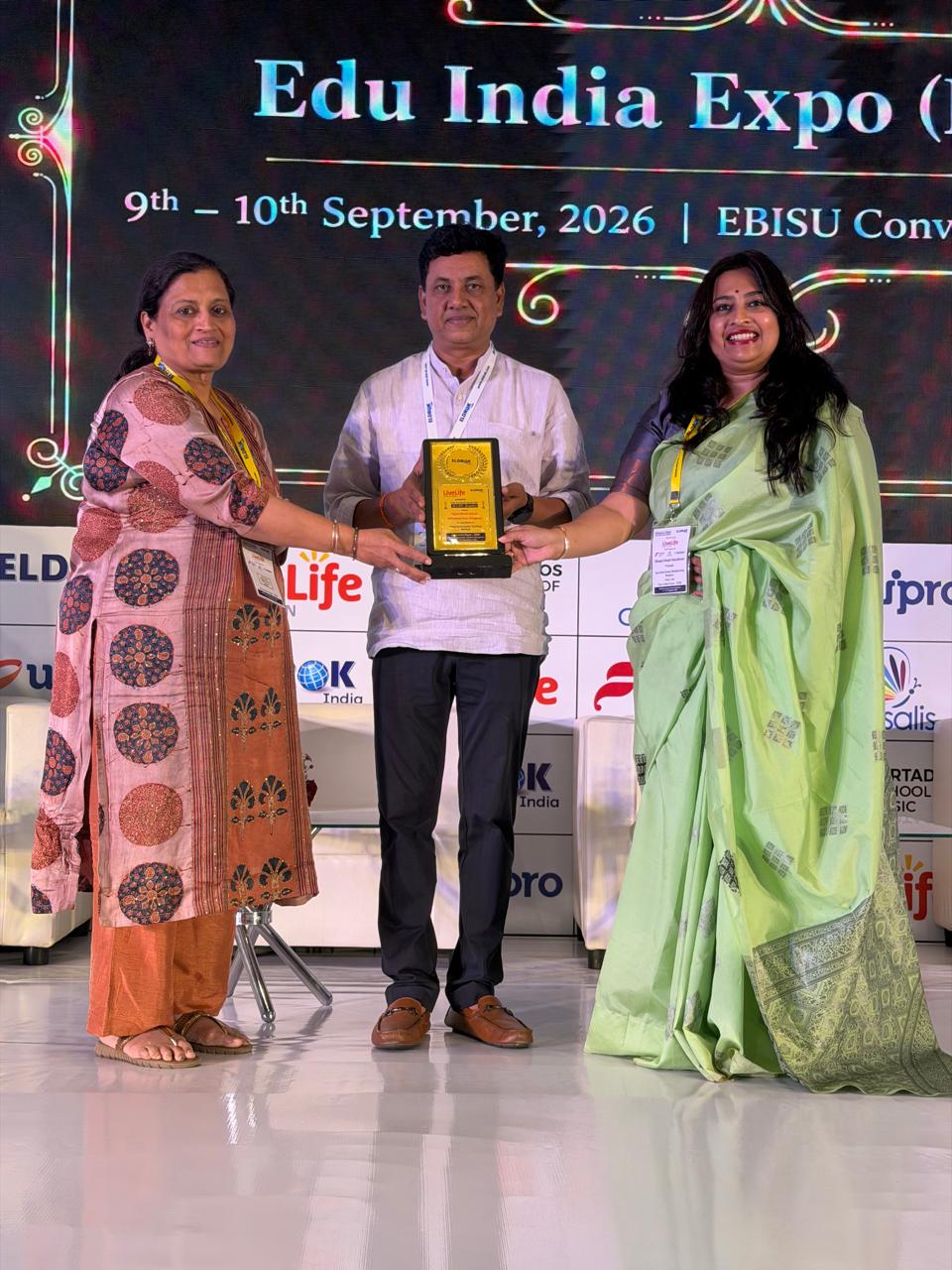 Ujjval World School receiving the Award for Excellence in Adopting Innovative Teaching Methods